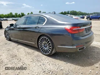2016 BMW 7 Series 740i with VIN WBA7E2C57GG714564, listed as a Copart auction lot 64005965 with 111,598 mi miles and Salvage title. Bid and sale history available at DreamBid. Image 2.
