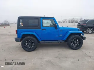 2014 Jeep Wrangler Arctic z VIN 1C4GJWBG3EL313350, wystawiony jako IAAI lot #41442520 z przebiegiem Nie podano mil oraz . Historia ofert i sprzedaży dostępna na DreamBid. Obrazek 13.