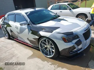 2014 Chrysler 300 with VIN 2C3CCAAG9EH103415, listed as a IAAI auction lot 42126837 with 111,597 mi miles. Bid and sale history available at carsss.com. Image 1.