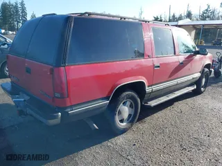 1996 GMC Suburban with VIN 1GKFK16R4TJ742646, listed as a IAAI auction lot 42004439 with 196,923 mi miles. Bid and sale history available at carsss.com. Image 4.