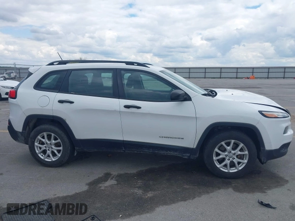 2015 Jeep Cherokee Sport z VIN 1C4PJMAB6FW773872, wystawiony jako IAAI lot #42376516 z przebiegiem 135 209 mil mil oraz . Historia ofert i sprzedaży dostępna na DreamBid. Obrazek 13.