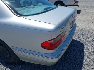 2002 Mercedes-Benz E-Class with VIN WDBJF65J72B441380, listed as a IAAI auction lot 42040268 with 210,471 mi miles. Bid and sale history available at carsss.com. Image 6.