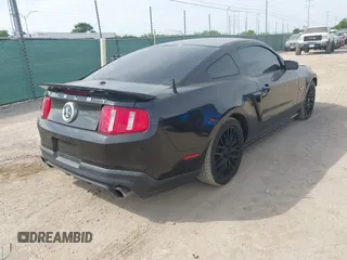 2010 Ford Mustang GT500 with VIN 1ZVBP8JS9A5130203, listed as a IAAI auction lot 42064720 with 32,461 mi miles. Bid and sale history available at carsss.com. Image 4.
