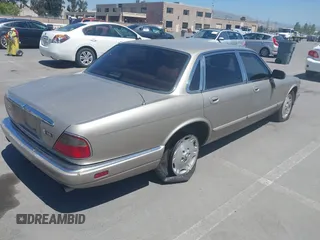 1997 Jaguar XJ with VIN SAJHX1243VC811674, listed as a IAAI auction lot 42333801 with 213,248 mi miles and . Bid and sale history available at DreamBid. Image 4.