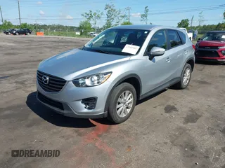 2016 Mazda CX-5 Touring z VIN JM3KE4CY4G0646114, wystawiony jako IAAI lot #42269181 z przebiegiem 58 252 mil mil oraz . Historia ofert i sprzedaży dostępna na DreamBid. Obrazek 18.