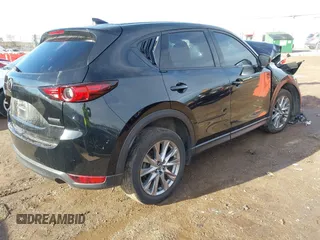 2021 Mazda CX-5 Grand Touring with VIN JM3KFBDM0M1357587, listed as a IAAI auction lot 41680245 with 1 mi miles. Bid and sale history available at carsss.com. Image 4.