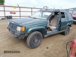 1994 Jeep Grand Cherokee Laredo with VIN 1J4GZ58S9RC215874, listed as a IAAI auction lot 42577378 with 230,824 mi miles and . Bid and sale history available at DreamBid. Image 2.