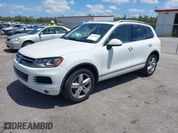 2012 Volkswagen Touareg Sport with VIN WVGEF9BP1CD008717, listed as a IAAI auction lot 42120641 with 211,580 mi miles and . Bid and sale history available at DreamBid. Image 17.