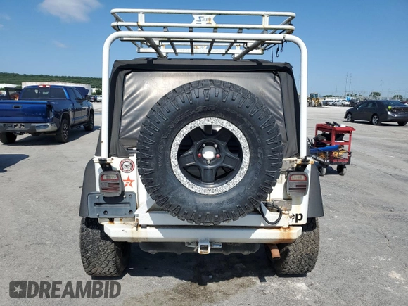 1999 Jeep Wrangler Sport with VIN 1J4FY19SXXP464096, listed as a Copart auction lot 61233105 with 167,350 mi miles and Clean title. Bid and sale history available at DreamBid. Image 6.