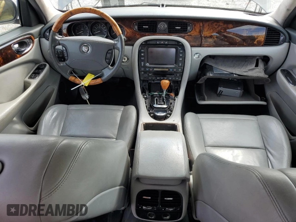 2006 Jaguar XJ with VIN SAJWA71B06SH03941, listed as a Copart auction lot 76013984 with 0 mi miles and Salvage Title. Bid and sale history available at carsss.com. Image 8.