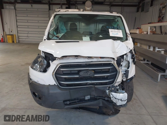 2020 Ford Transit Cargo with VIN 1FTBR1Y81LKA19650, listed as a IAAI auction lot 42727232 with 103,676 mi miles and . Bid and sale history available at DreamBid. Image 12.