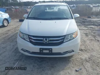 2014 Honda Odyssey Touring with VIN 5FNRL5H97EB127836, listed as a IAAI auction lot 41497413 with 174,914 mi miles and . Bid and sale history available at DreamBid. Image 12.