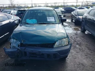 1999 Honda CR-V LX with VIN JHLRD1847XC049104, listed as a IAAI auction lot 42002338 with 213,503 mi miles. Bid and sale history available at carsss.com. Image 12.