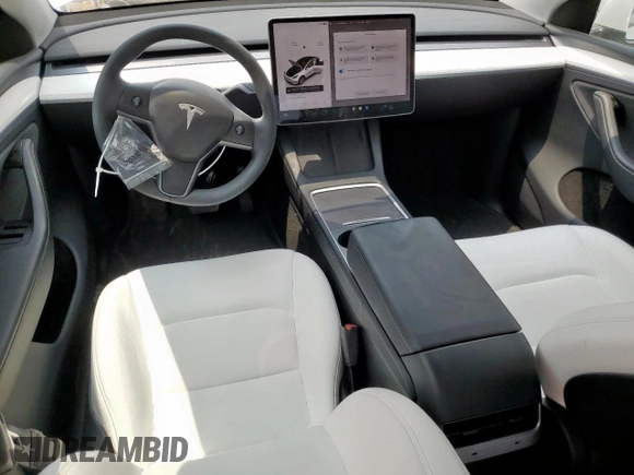 2024 Tesla Model Y Long Range with VIN 7SAYGDEE6RA290124, listed as a Copart auction lot 57662385 with 14,751 mi miles and Salvage title. Bid and sale history available at DreamBid. Image 8.