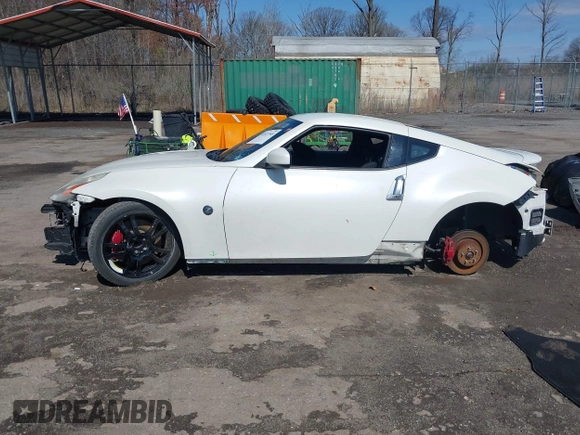 2014 Nissan 370Z with VIN JN1AZ4EH8EM634403, listed as a IAAI auction lot 41923568 with 137,676 mi miles. Bid and sale history available at carsss.com. Image 14.