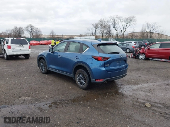 2019 Mazda CX-5 Sport with VIN JM3KFBBM5K0668678, listed as a IAAI auction lot 41811146 with 102,634 mi miles and . Bid and sale history available at DreamBid. Image 3.