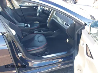 2014 Tesla Model S 60 with VIN 5YJSA1H14EFP57209, listed as a IAAI auction lot 41305157 with 141,364 mi miles and . Bid and sale history available at DreamBid. Image 5.