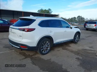 2016 Mazda CX-9 Grand Touring z VIN JM3TCADY4G0124588, wystawiony jako IAAI lot #41192549 z przebiegiem 161 272 mil mil oraz . Historia ofert i sprzedaży dostępna na DreamBid. Obrazek 4.