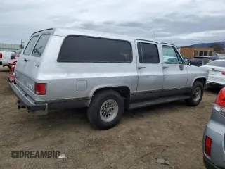 1990 GMC Suburban z VIN 1GKGR26N7LF537148, wystawiony jako Copart lot #45388815 z przebiegiem 265 951 mil mil oraz Tytuł czysty. Historia ofert i sprzedaży dostępna na DreamBid. Obrazek 3.