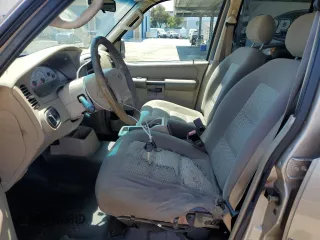 2004 Ford Explorer Sport Trac XLS z VIN 1FMZU67K14UB52529, wystawiony jako Copart lot #64686125 z przebiegiem 227 629 mil mil oraz Szkoda całkowita • Salvage title. Historia ofert i sprzedaży dostępna na DreamBid. Obrazek 7.