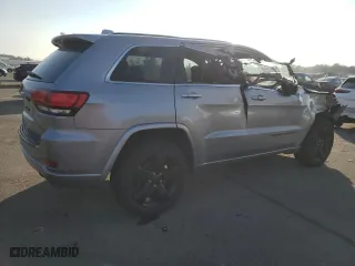 2015 Jeep Grand Cherokee Altitude with VIN 1C4RJFAG0FC136039, listed as a Copart auction lot 89237525 with 124,374 mi miles and Salvage Title. Bid and sale history available at carsss.com. Image 3.