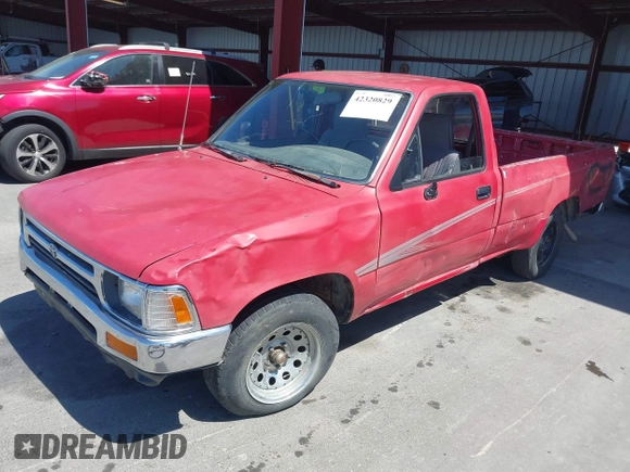 1992 Toyota Pickup DLX z VIN JT4RN82P8N5056666, wystawiony jako IAAI lot #42320829 z przebiegiem 147 032 mil mil oraz . Historia ofert i sprzedaży dostępna na DreamBid. Obrazek 2.