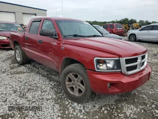 2010 Dodge Dakota SXT with VIN 1D7CW3GP8AS230686, listed as a Copart auction lot 65687704 with 110,017 mi miles and Salvage Title. Bid and sale history available at carsss.com. Image 4.