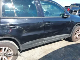 2012 Volkswagen Tiguan LE with VIN WVGAV7AX1CW557250, listed as a IAAI auction lot 42300694 with 122,310 mi miles and . Bid and sale history available at DreamBid. Image 6.