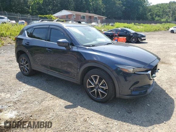 2018 Mazda CX-5 Grand Touring with VIN JM3KFBDM8J0342272, listed as a Copart auction lot 61930115 with 119,727 mi miles and Salvage title. Bid and sale history available at DreamBid. Image 4.