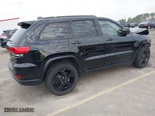 2019 Jeep Grand Cherokee Laredo E with VIN 1C4RJEAGXKC571770, listed as a IAAI auction lot 41677487 with 113,089 mi miles. Bid and sale history available at carsss.com. Image 4.