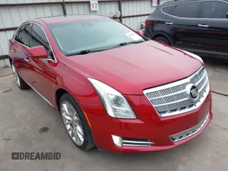 2013 Cadillac XTS Platinum z VIN 2G61U5S32D9108163, wystawiony jako IAAI lot #41402585 z przebiegiem 86 597 mil mil oraz . Historia ofert i sprzedaży dostępna na DreamBid. Obrazek 1.