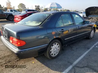 1997 Mercedes-Benz E 320 with VIN WDBJF55FXVA430115, listed as a Copart auction lot 43053715 with 158,057 mi miles and Clean Title. Bid and sale history available at DreamBid. Image 3.