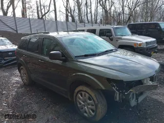2018 Dodge Journey SE with VIN 3C4PDCABXJT496661, listed as a IAAI auction lot 41908124 with 82,257 mi miles. Bid and sale history available at carsss.com. Image 1.
