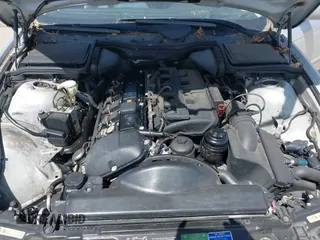 2001 BMW 5 Series 530iA with VIN WBADT63411CF01165, listed as a IAAI auction lot 42101589 with 151,243 mi miles. Bid and sale history available at carsss.com. Image 10.