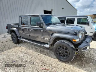 2023 Jeep Gladiator Overland with VIN 1C6HJTFG5PL560876, listed as a Copart auction lot 63239105 with 51,205 mi miles and Clean title. Bid and sale history available at DreamBid. Image 4.