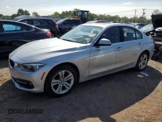 2018 BMW 3 Series with VIN WBA8F1C59JK898499, listed as a Copart auction lot 68247874 with 107,189 mi miles and Salvage title. Bid and sale history available at DreamBid. Image 1.