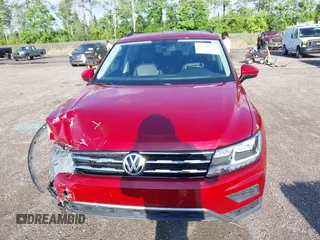 2018 Volkswagen Tiguan SEL z VIN 3VV3B7AX3JM054842, wystawiony jako IAAI lot #42240503 z przebiegiem 47 300 mil mil oraz . Historia ofert i sprzedaży dostępna na DreamBid. Obrazek 12.