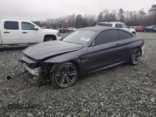 2015 BMW M4 with VIN WBS3R9C54FK330180, listed as a Copart auction lot 40706044 with 69,474 mi miles. Bid and sale history available at carsss.com. Image 1.