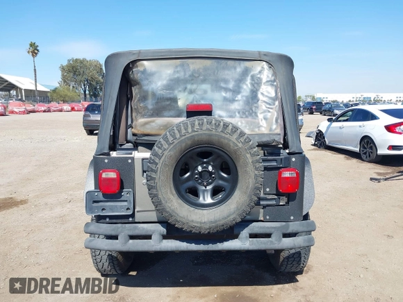 2005 Jeep Wrangler Sport with VIN 1J4FA49S65P342497, listed as a IAAI auction lot 41674606 with 123,457 mi miles. Bid and sale history available at carsss.com. Image 16.