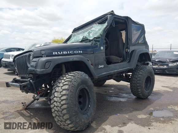 2004 Jeep Wrangler Rubicon z VIN 1J4FA69S84P727716, wystawiony jako IAAI lot #42162129 z przebiegiem 90 844 mil mil oraz . Historia ofert i sprzedaży dostępna na DreamBid. Obrazek 18.