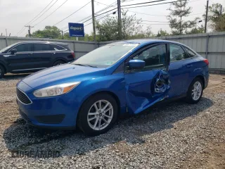 2018 Ford Focus SE z VIN 1FADP3F27JL288967, wystawiony jako Copart lot #59877235 z przebiegiem 143 479 mil mil oraz Szkoda całkowita • Salvage title. Historia ofert i sprzedaży dostępna na DreamBid. Obrazek 1.