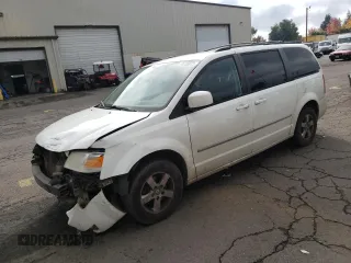 2010 Dodge Grand Caravan SXT with VIN 2D4RN5D11AR331804, listed as a Copart auction lot 73735873 with 183,923 mi miles and Salvage Title. Bid and sale history available at DreamBid. Image 1.