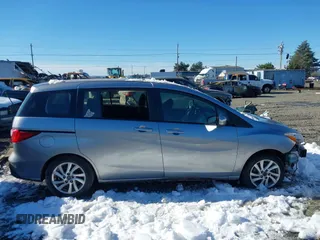 2014 Mazda 5 Sport with VIN JM1CW2BLXE0168119, listed as a IAAI auction lot 41527688 with 142,357 mi miles and . Bid and sale history available at DreamBid. Image 13.
