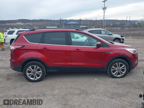 2018 Ford Escape SE z VIN 1FMCU9GD6JUA18684, wystawiony jako IAAI lot #41499540 z przebiegiem 105 127 mil mil oraz . Historia ofert i sprzedaży dostępna na DreamBid. Obrazek 13.