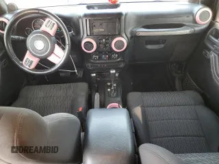 2012 Jeep Wrangler Unlimited Sport with VIN 1C4BJWDG8CL116811, listed as a Copart auction lot 59372085 with 95,498 mi miles and Salvage title. Bid and sale history available at DreamBid. Image 8.