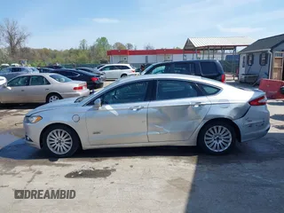 2016 Ford Fusion Energi SE Luxury with VIN 3FA6P0PU8GR273122, listed as a IAAI auction lot 42062083 with 166,318 mi miles. Bid and sale history available at carsss.com. Image 14.