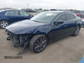 2018 Mazda 6 Grand Touring with VIN JM1GL1TY3J1334600, listed as a IAAI auction lot 41060893 with 64,852 mi miles and . Bid and sale history available at DreamBid. Image 18.