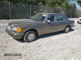 1987 Mercedes-Benz 420 Series 420SEL with VIN WDBCA35D0HA311262, listed as a Copart auction lot 71760554 with 185,520 mi miles and Salvage Title. Bid and sale history available at carsss.com. Image 1.