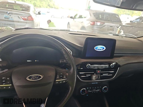 2020 Ford Escape Titanium Hybrid with VIN 1FMCU0DZ2LUB82013, listed as a IAAI auction lot 42727391 with 92,623 mi miles and . Bid and sale history available at DreamBid. Image 14.