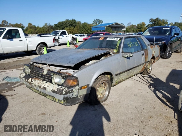 1984 Toyota Celica z VIN JT2RA64C7E6218560, wystawiony jako Copart lot #63087872 z przebiegiem 168 288 mil mil oraz Czysty tytuł • Clean title. Historia ofert i sprzedaży dostępna na DreamBid. Obrazek 2.